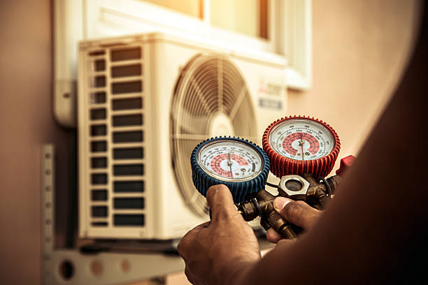 Professional Heat Pump Repair technician working in Hemlock, IN